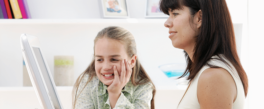 Mom with daughter on computer