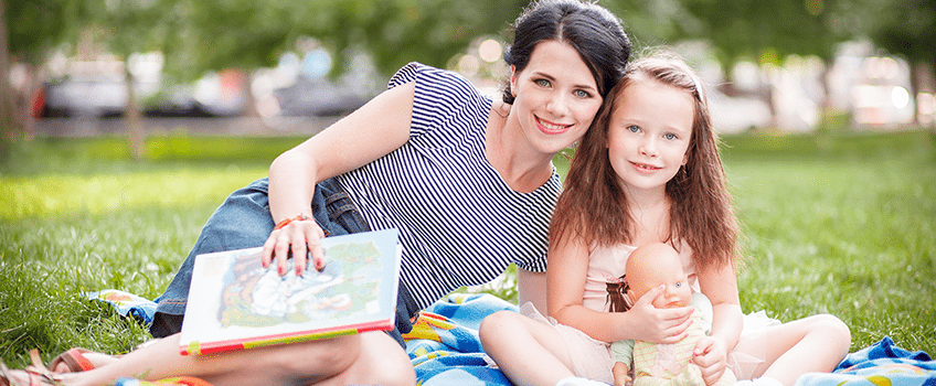 Mother Outside Playing with Daughter During Summer