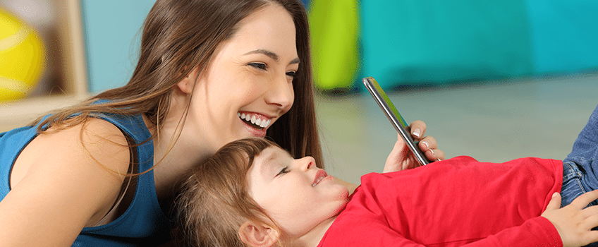 5 Simple Ways to Avoid Fake Mom Influencers - Mother and Child on Phone