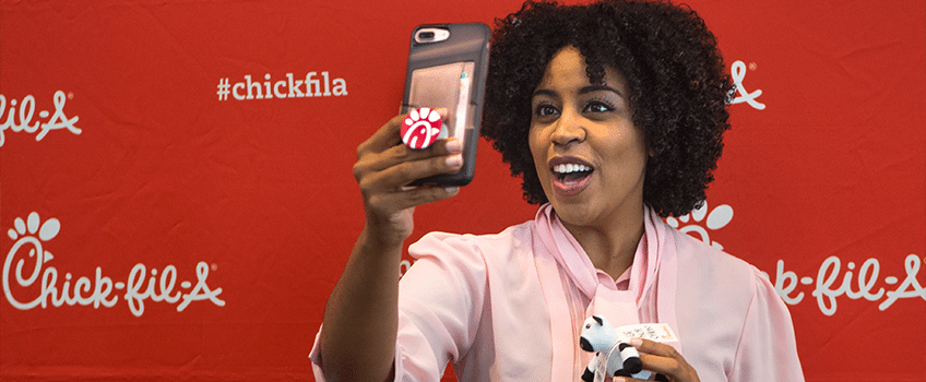 Chick-fil-A Moms Panel member taking a selfie at headquarters in Atlanta, GA