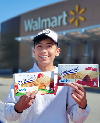 Boy showing snacks outside of Walmart