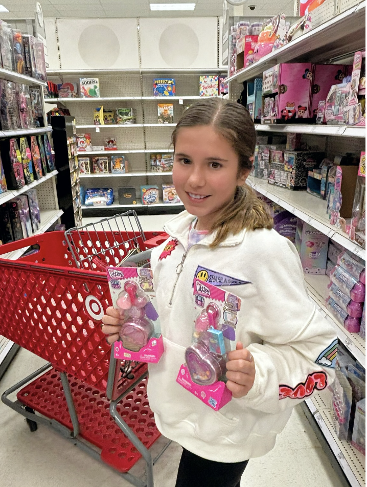 Mom influencer creating in-store product content for a Target toy campaign